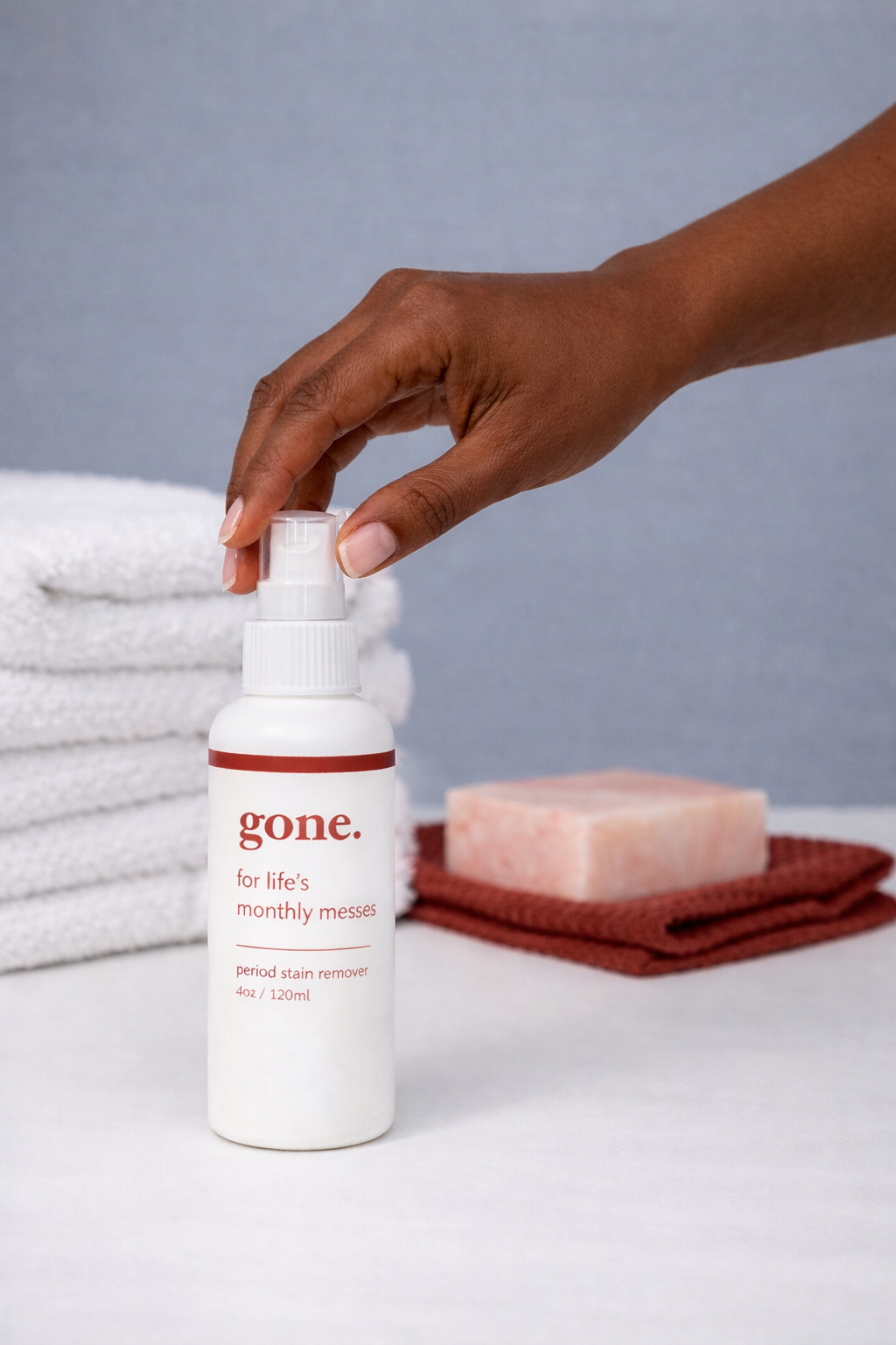 Reaching for gone. period stain remover.