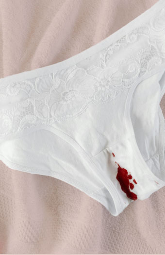 Period stain on white underwear.